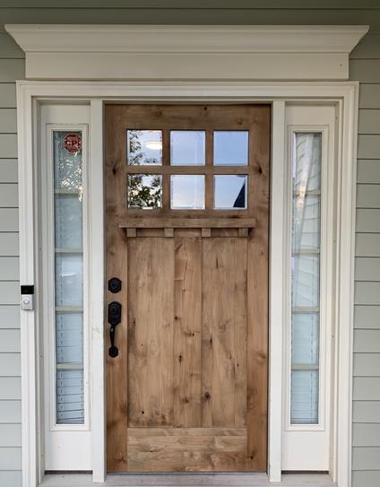 Wood entry door and surrounding trim