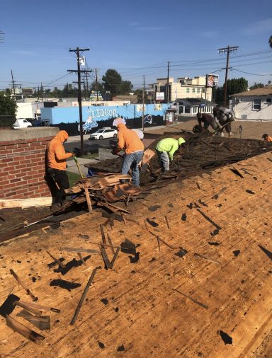 Exposed 1x1 Roof Decking Crew removing existing roofing during a residential roof replacement project