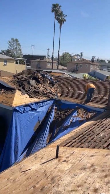 Roof Deck Removal Roof tear-off and wood deck removal during residential reroof project