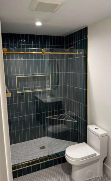 Bathroom Remodel – Walk-In Shower Bathroom remodel with dark tile walk-in shower and brass fixtures