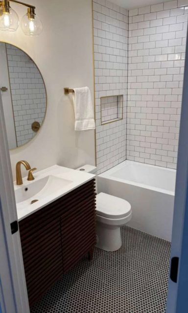Bathroom Remodel – Tub & Tile Bathroom remodel with subway tile tub surround, wood vanity and brass fixtures