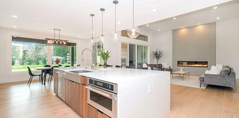 Modern residential home remodel with open kitchen, living space, updated finishes, and coordinated interior renovation