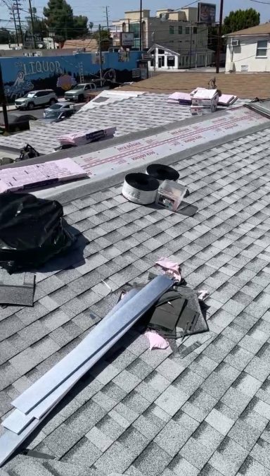 Owens Corning Deck Defense roof underlayment installed over new roof decking New architectural asphalt shingles being installed over roof underlayment